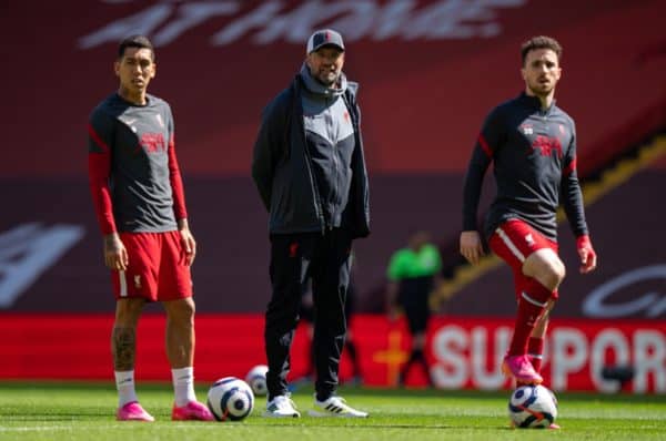 LIVERPOOL, ENGLAND - Saturday 24 April 2021: Liverpool manager Jurgen Klopp (C) with Roberto Firmino (L) and Diogo Jota (R) during the pre-match warm-up before the FA Premier League game between Liverpool FC and Newcastle United FC in Anfield.  (Image by David Rawcliffe / Propaganda)