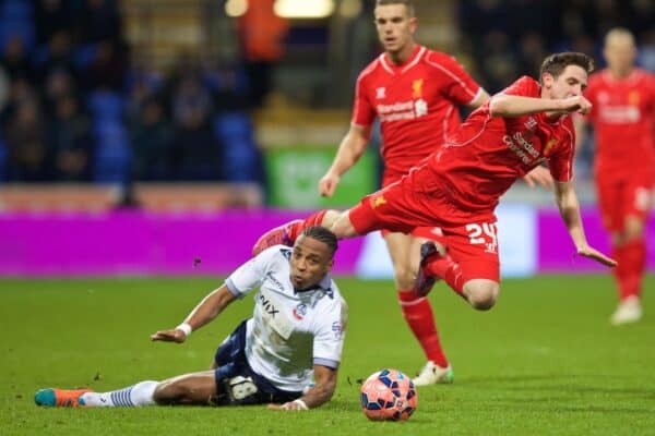 BOLTON, ENGLAND - Wednesday February 4, 2015: Liverpool's Joe Allen is fouled by Bolton Wanderers Neil Danns, who was subsequently sent off, during the FA Cup 4th Round Replay game at Reebok Stadium. (Image by David Rawcliffe / Propaganda)
